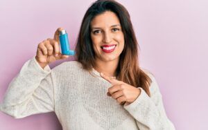 Woman Holding Asthma Respirator